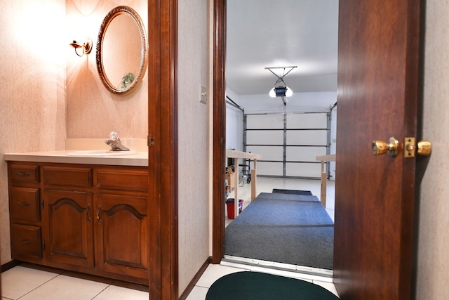 bathroom featuring tile patterned flooring and vanity