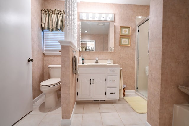 bathroom with tile patterned flooring, vanity, an enclosed shower, and toilet