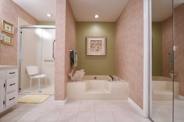 bathroom featuring tile patterned flooring and shower with separate bathtub