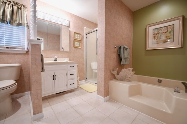 full bathroom with toilet, vanity, tile patterned floors, and independent shower and bath