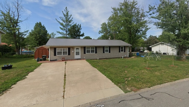 4 Grim Ct N, Kirksville, MO 63501 - single story home with a shed, a metal roof, a front yard, and driveway