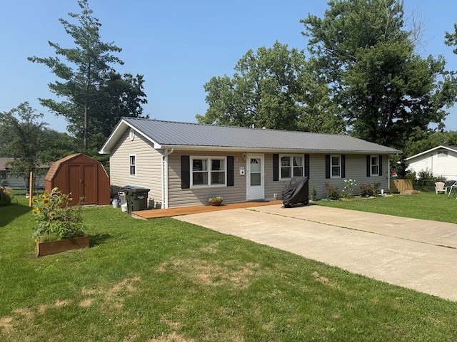 4 Grim Ct N, Kirksville, MO 63501 - ranch-style home with a storage shed, a metal roof, and a front yard