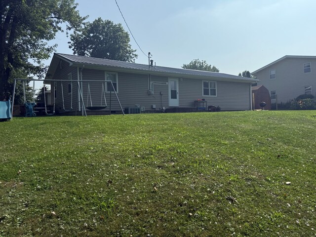 4 Grim Ct N, Kirksville, MO 63501 - rear view of property featuring a yard and a metal roof
