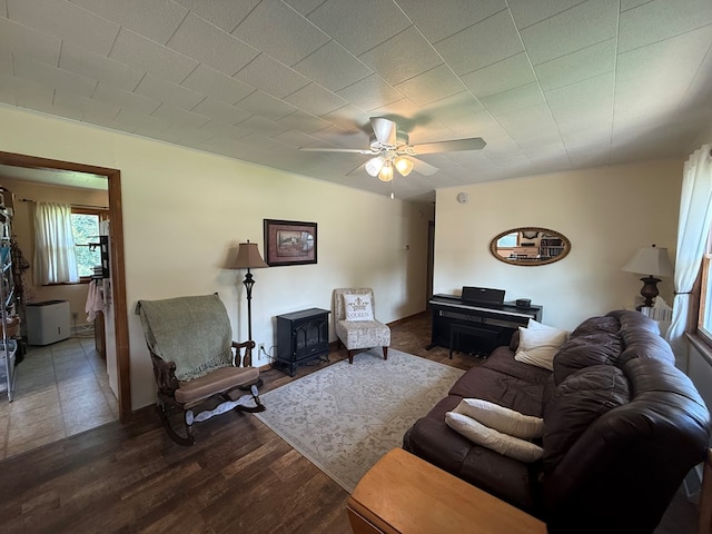 4 Grim Ct N, Kirksville, MO 63501 - living area with a wood stove, a ceiling fan, and wood finished floors