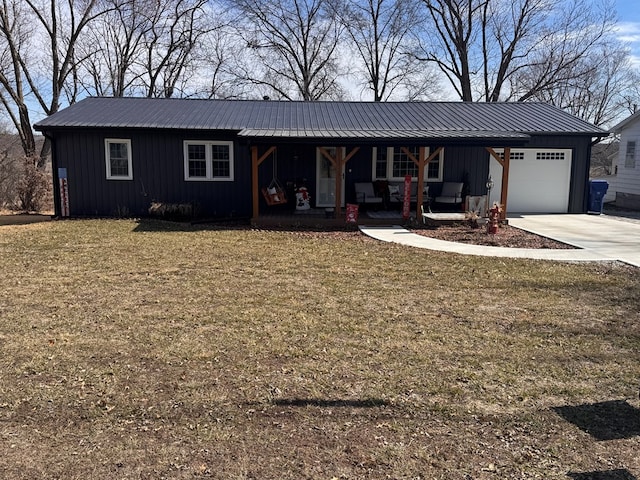 ranch-style house featuring a porch, board and batten siding, metal roof, a garage, and driveway