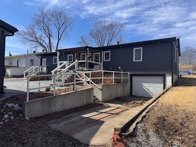 manufactured / mobile home featuring a garage and driveway