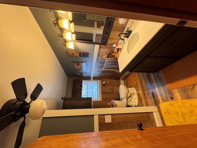 bathroom featuring wooden walls