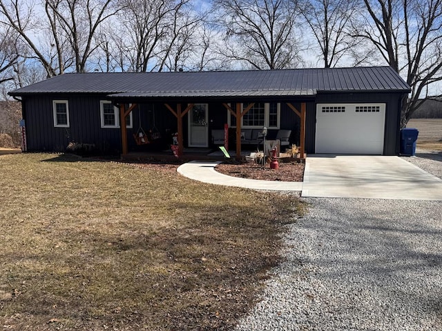 single story home featuring driveway, a garage, metal roof, covered porch, and board and batten siding