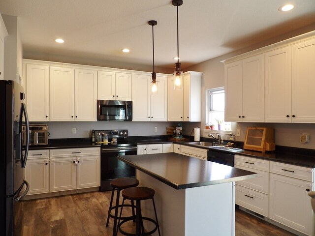 1109 Steer Creek Way, Kirksville, MO 63501 - kitchen featuring recessed lighting, a sink, white cabinetry, black appliances, and dark countertops