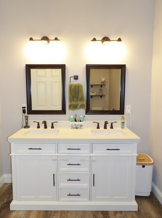 1109 Steer Creek Way, Kirksville, MO 63501 - full bathroom with double vanity, baseboards, a sink, and wood finished floors