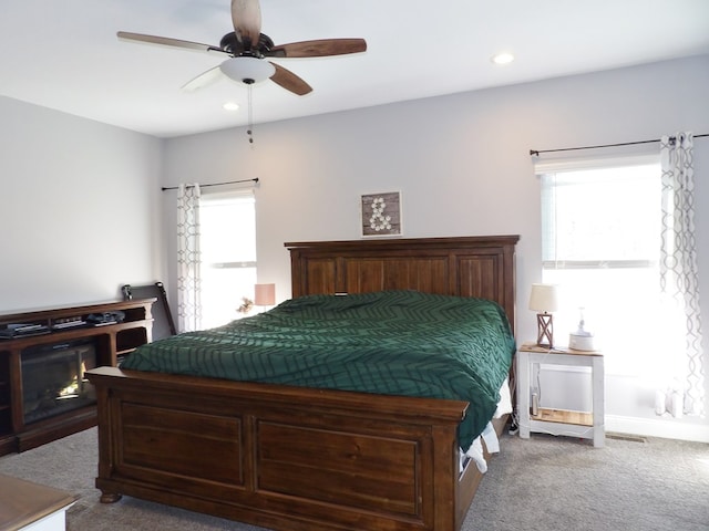 1109 Steer Creek Way, Kirksville, MO 63501 - carpeted bedroom with ceiling fan, multiple windows, and recessed lighting