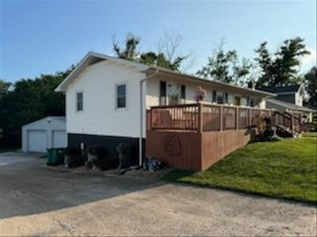 816 Locust St, Macon, MO 63552 - view of property exterior with an outdoor structure and a yard