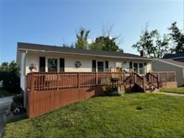 816 Locust St, Macon, MO 63552 - rear view of house featuring a deck and a lawn