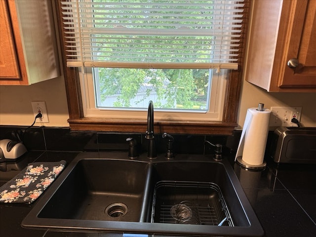 816 Locust St, Macon, MO 63552 - kitchen view of dark countertops and brown cabinets