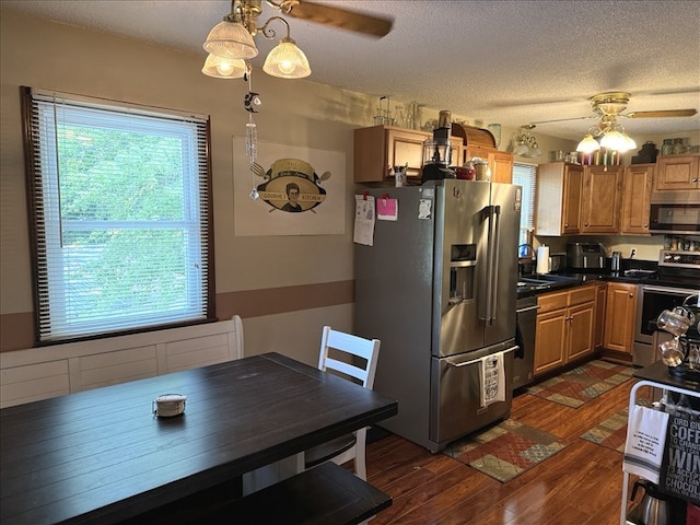 816 Locust St, Macon, MO 63552 - kitchen with ceiling fan, appliances with stainless steel finishes, dark wood-type flooring, dark countertops, and a textured ceiling