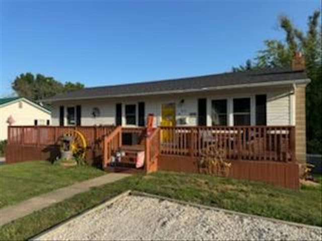 816 Locust St, Macon, MO 63552 - view of front of property featuring a wooden deck and a chimney