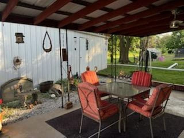 816 Locust St, Macon, MO 63552 - view of patio featuring outdoor dining area