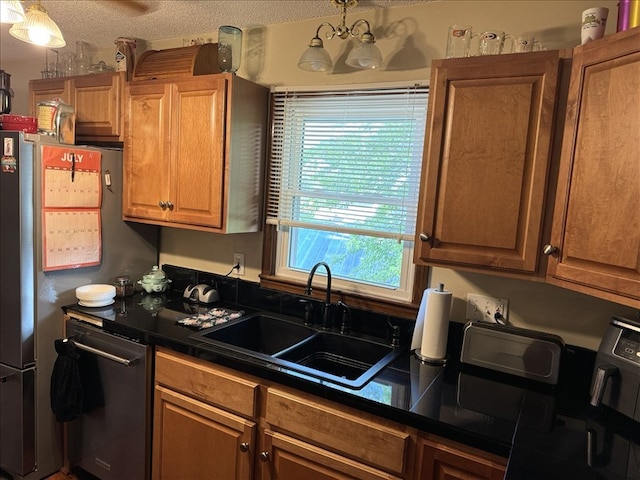 816 Locust St, Macon, MO 63552 - kitchen with dark countertops, appliances with stainless steel finishes, and brown cabinets