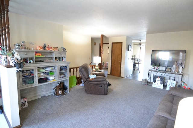 carpeted living room featuring ceiling fan