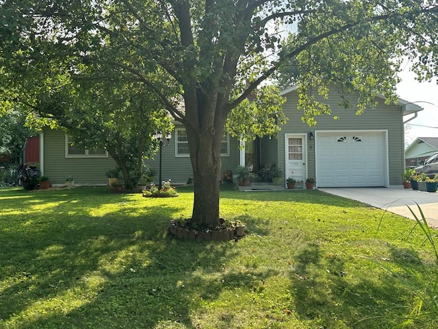 view of front facade with a garage and a front lawn