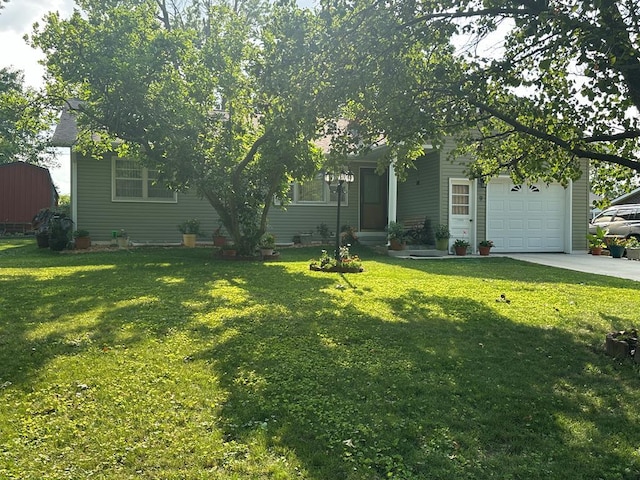 view of front of home with a front yard and a garage