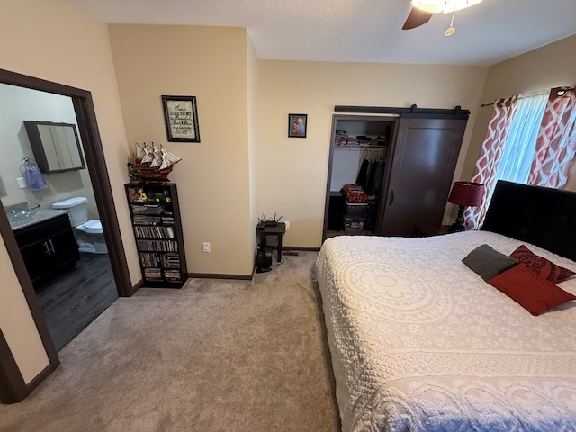 bedroom with a closet, carpet flooring, ceiling fan, and baseboards