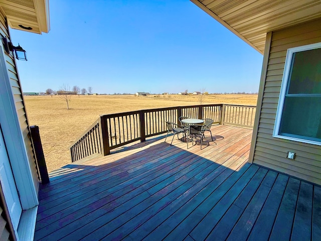 wooden deck featuring a rural view