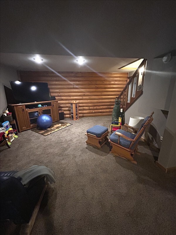 28730 State Highway T, Excello, MO 65247 - living room with rustic walls and carpet