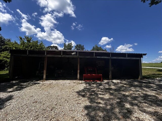 28730 State Highway T, Excello, MO 65247 - rear view of property with a carport and a pole building