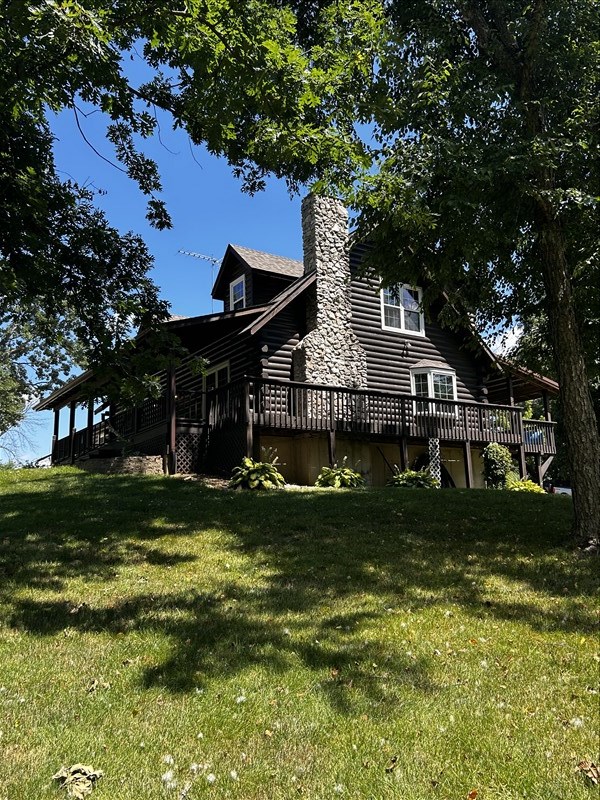 28730 State Highway T, Excello, MO 65247 - view of side of property with a chimney, a wooden deck, a yard, and log siding