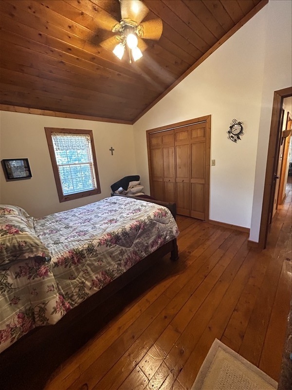 28730 State Highway T, Excello, MO 65247 - bedroom with hardwood / wood-style floors, wooden ceiling, high vaulted ceiling, a ceiling fan, and a closet
