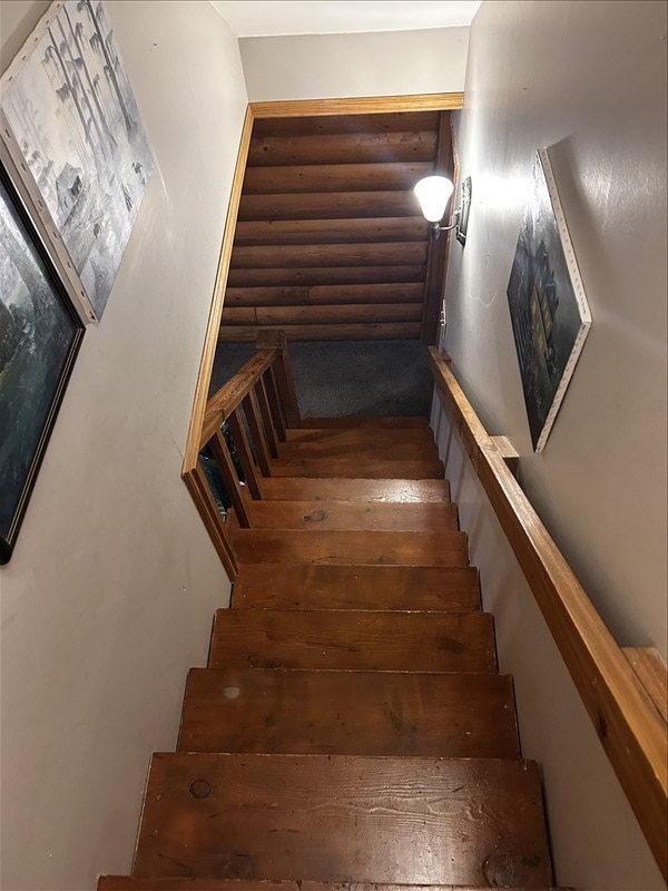 28730 State Highway T, Excello, MO 65247 - stairs featuring hardwood / wood-style floors and log walls