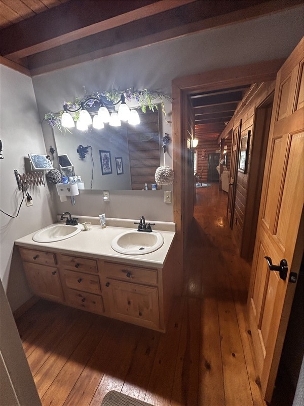 28730 State Highway T, Excello, MO 65247 - full bath featuring hardwood / wood-style floors, double vanity, and a wood ceiling with exposed beams