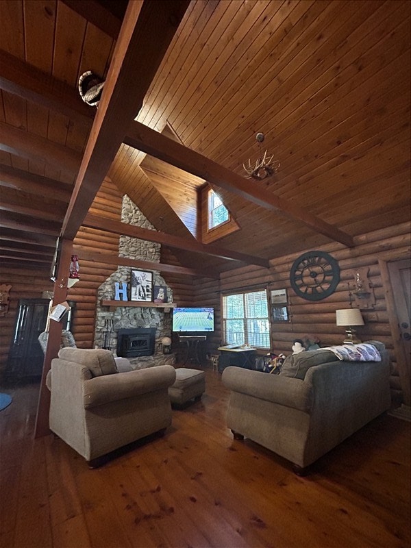 28730 State Highway T, Excello, MO 65247 - living room with log walls, a stone fireplace, hardwood / wood-style flooring, a wooden ceiling with exposed beams, and high vaulted ceiling