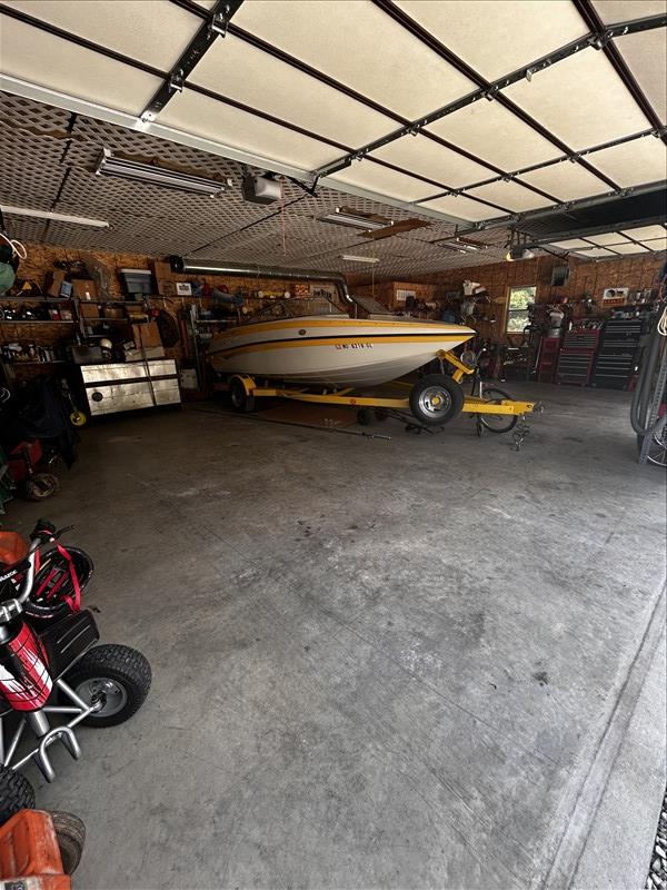 28730 State Highway T, Excello, MO 65247 - garage featuring a garage door opener
