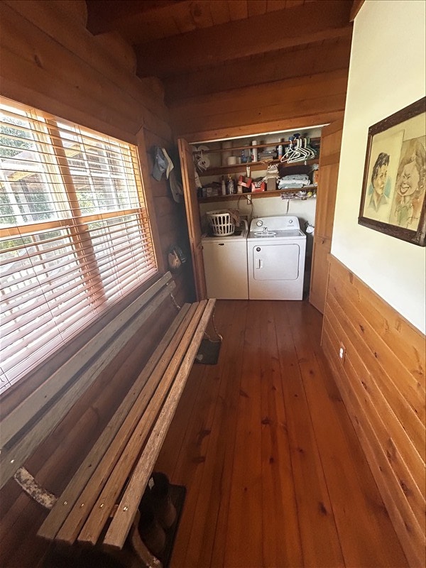28730 State Highway T, Excello, MO 65247 - hall featuring independent washer and dryer, wood walls, dark wood-style floors, and beamed ceiling