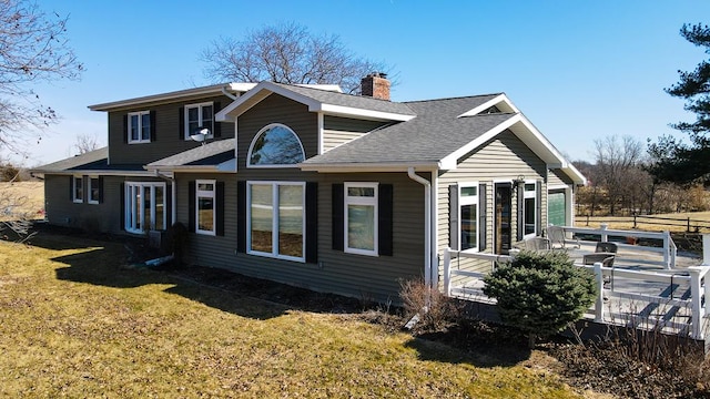 exterior space featuring a chimney, fence, a front yard, and roof with shingles