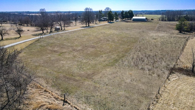 birds eye view of property featuring a rural view