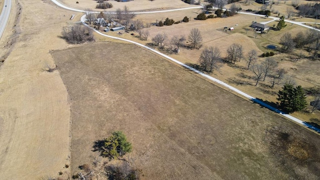 birds eye view of property with a rural view