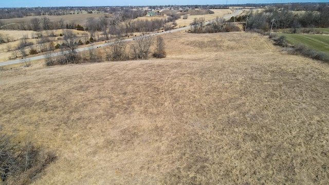 birds eye view of property featuring a rural view