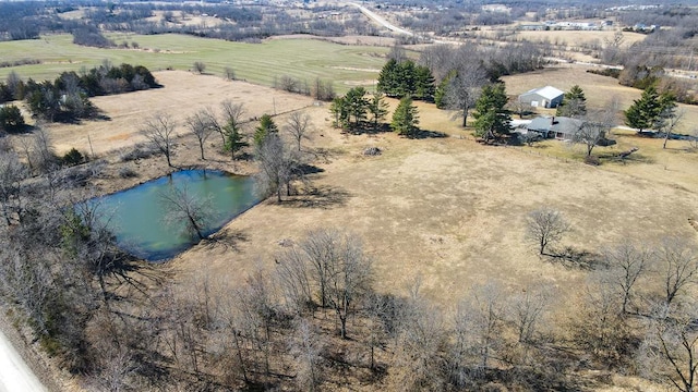 birds eye view of property featuring a rural view