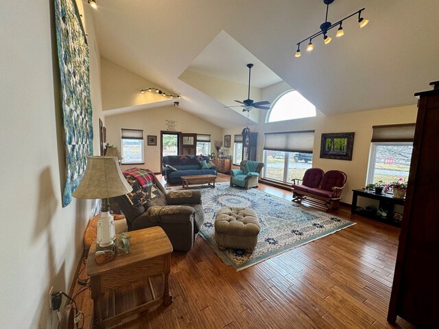 living room featuring track lighting, high vaulted ceiling, ceiling fan, and hardwood / wood-style floors