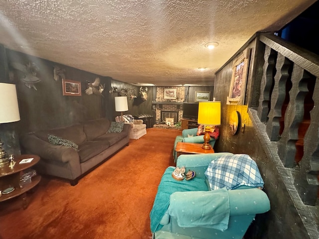 carpeted living room featuring a brick fireplace and a textured ceiling