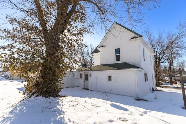 view of snow covered house