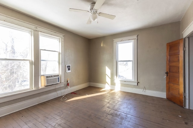 unfurnished room featuring ceiling fan, cooling unit, and hardwood / wood-style flooring