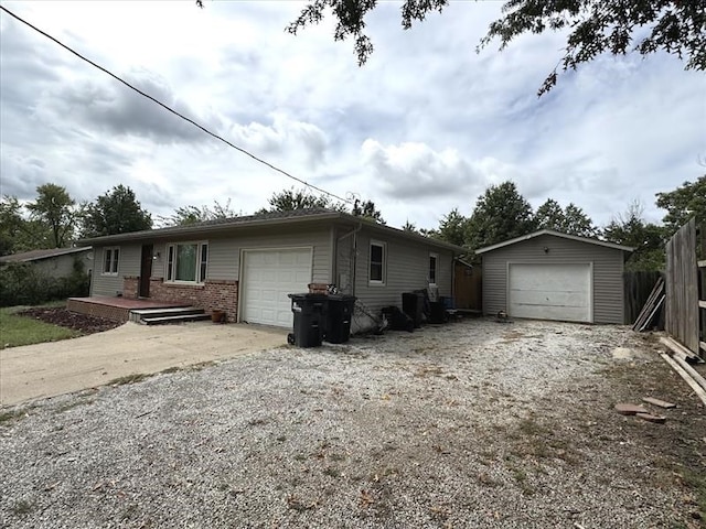 ranch-style house with an outbuilding and a garage