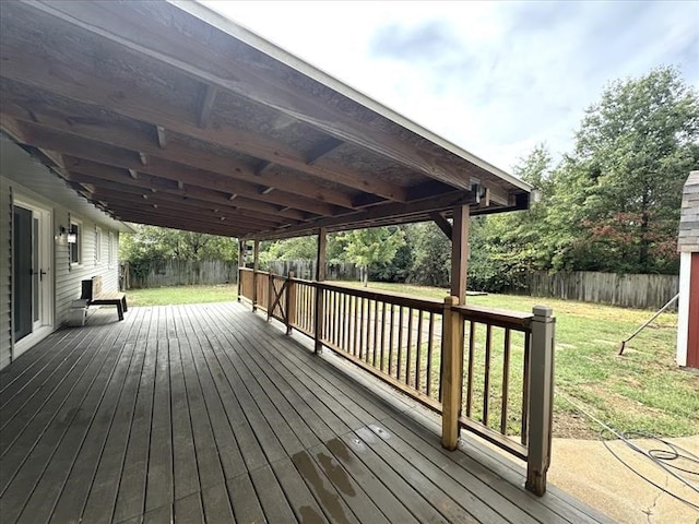 wooden deck featuring a yard