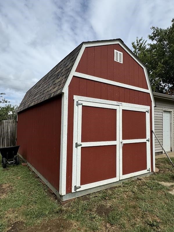 view of outdoor structure with a lawn