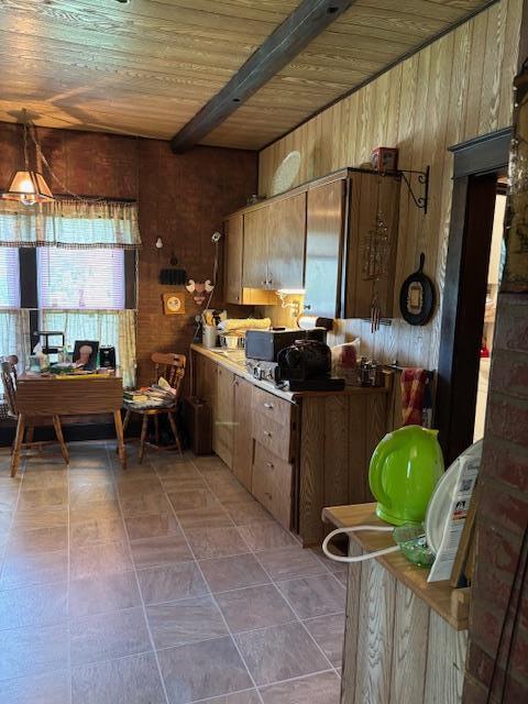 502 N Main St, Linneus, MO 64653 - kitchen with wooden walls and a wooden ceiling with exposed beams