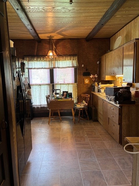 502 N Main St, Linneus, MO 64653 - kitchen featuring a wooden ceiling with exposed beams, brown cabinetry, and wood walls